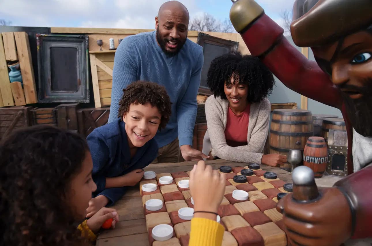 Family playing checkers together